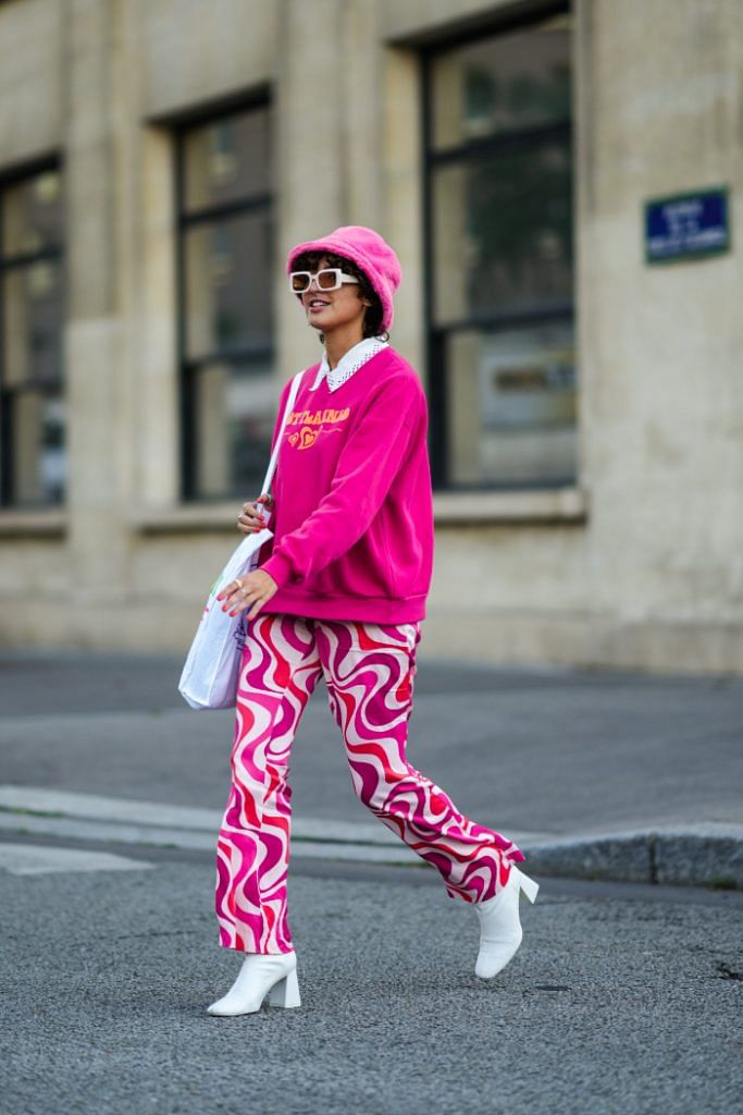Seven Wildly Different Ways To Style A Vibrant Pink Outfit-Swirl Patterned Pants
